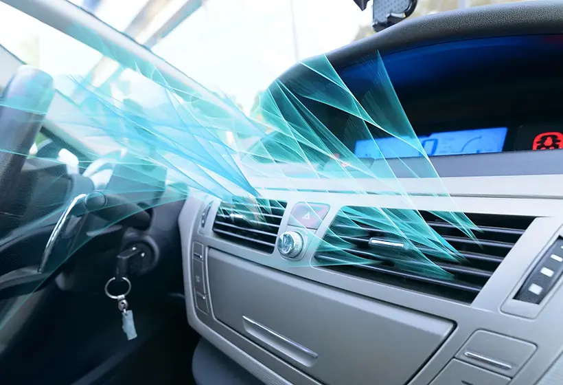 Cold air blowing from a car dashboard vent