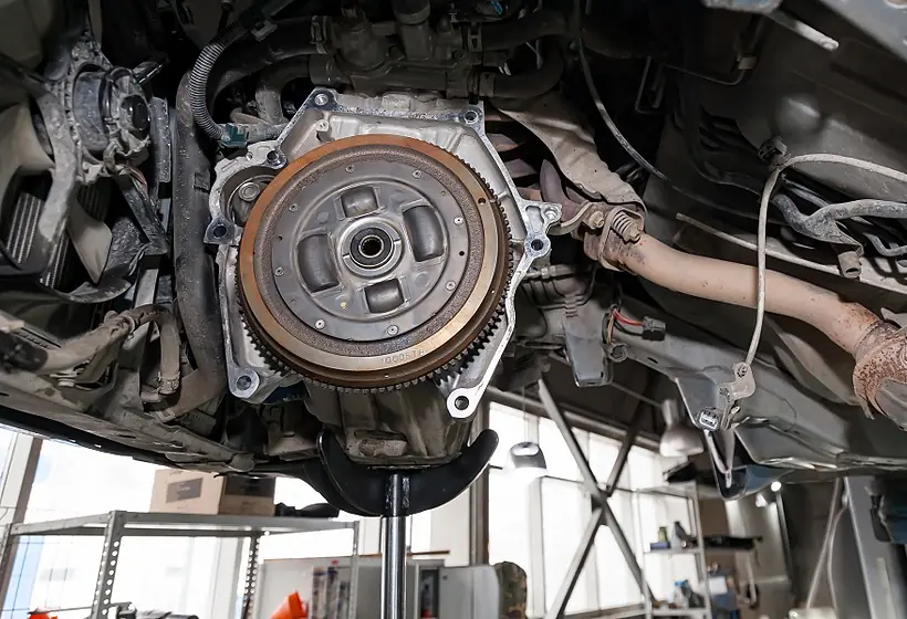 Mechanic holding a transmission gear assembly